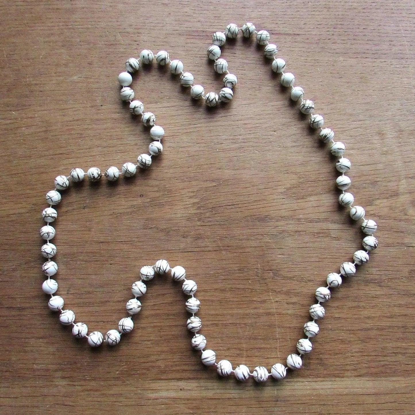 1980s white and gold abstract splatter bead slip-on necklace