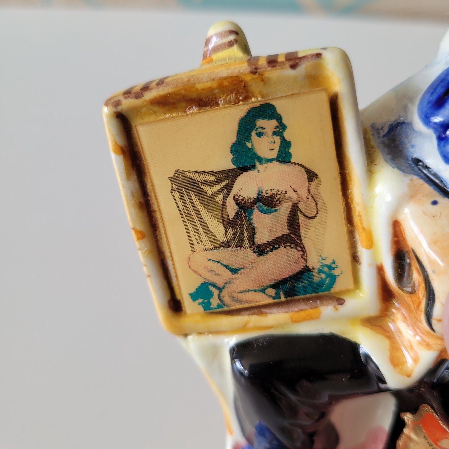 1960s Drioli miniature liquor bottle/decanter: artist & risqué painting, animated