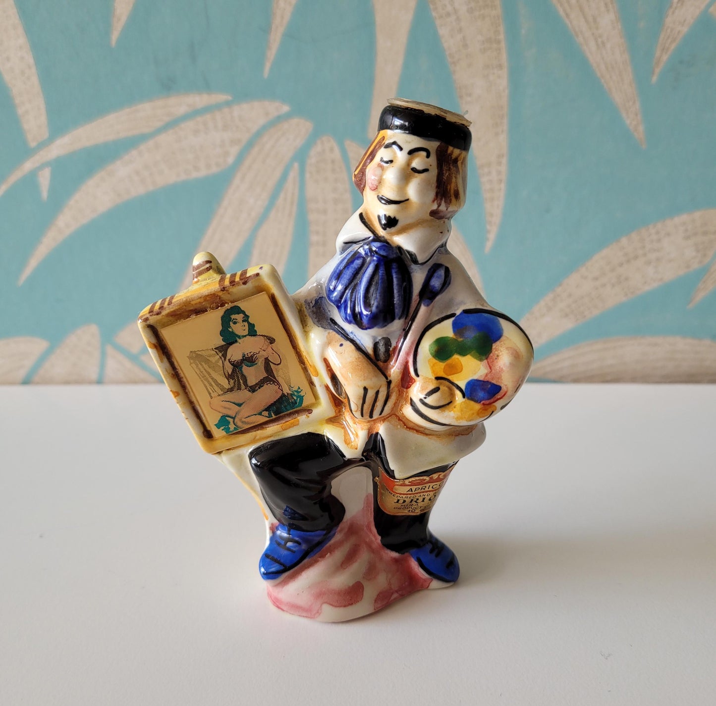 1960s Drioli miniature liquor bottle/decanter: artist & risqué painting, animated