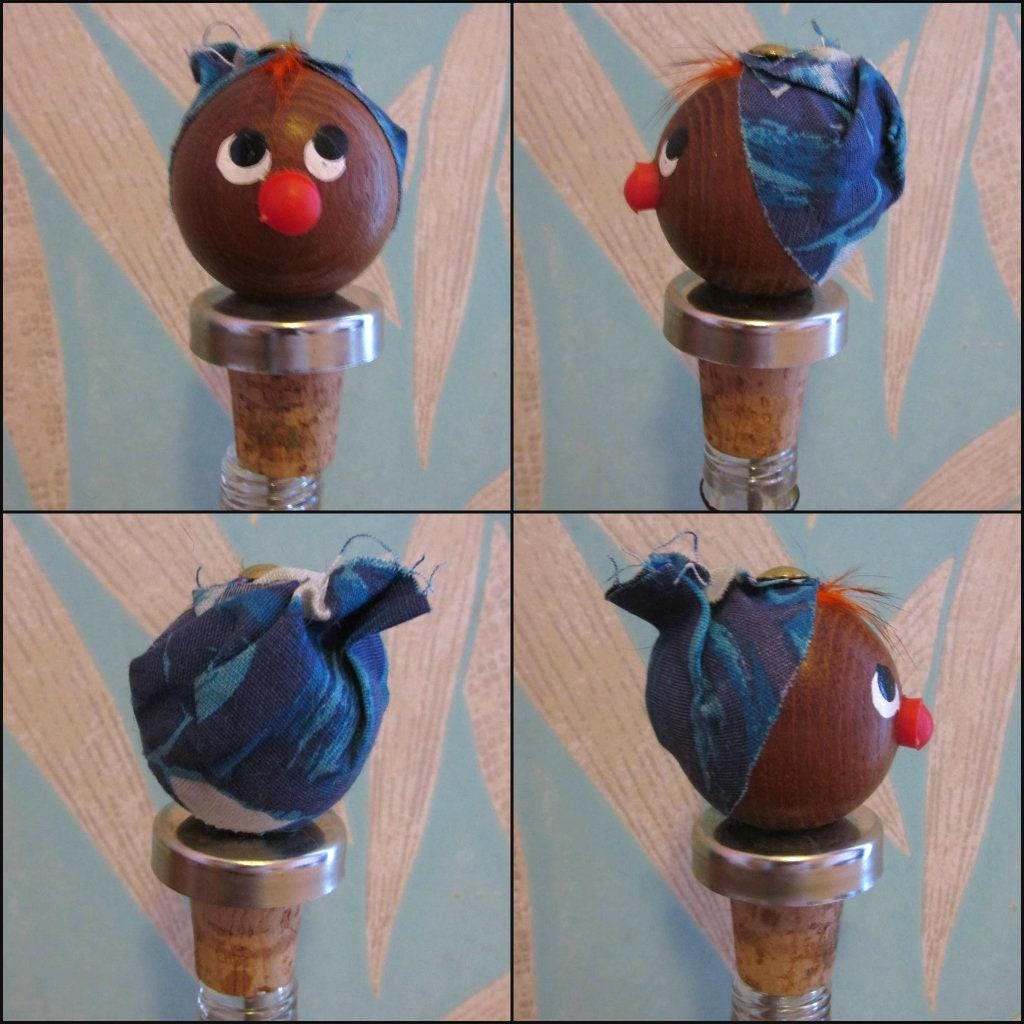Three 1960s Gonk-style wooden character bottle stoppers/pourouts
