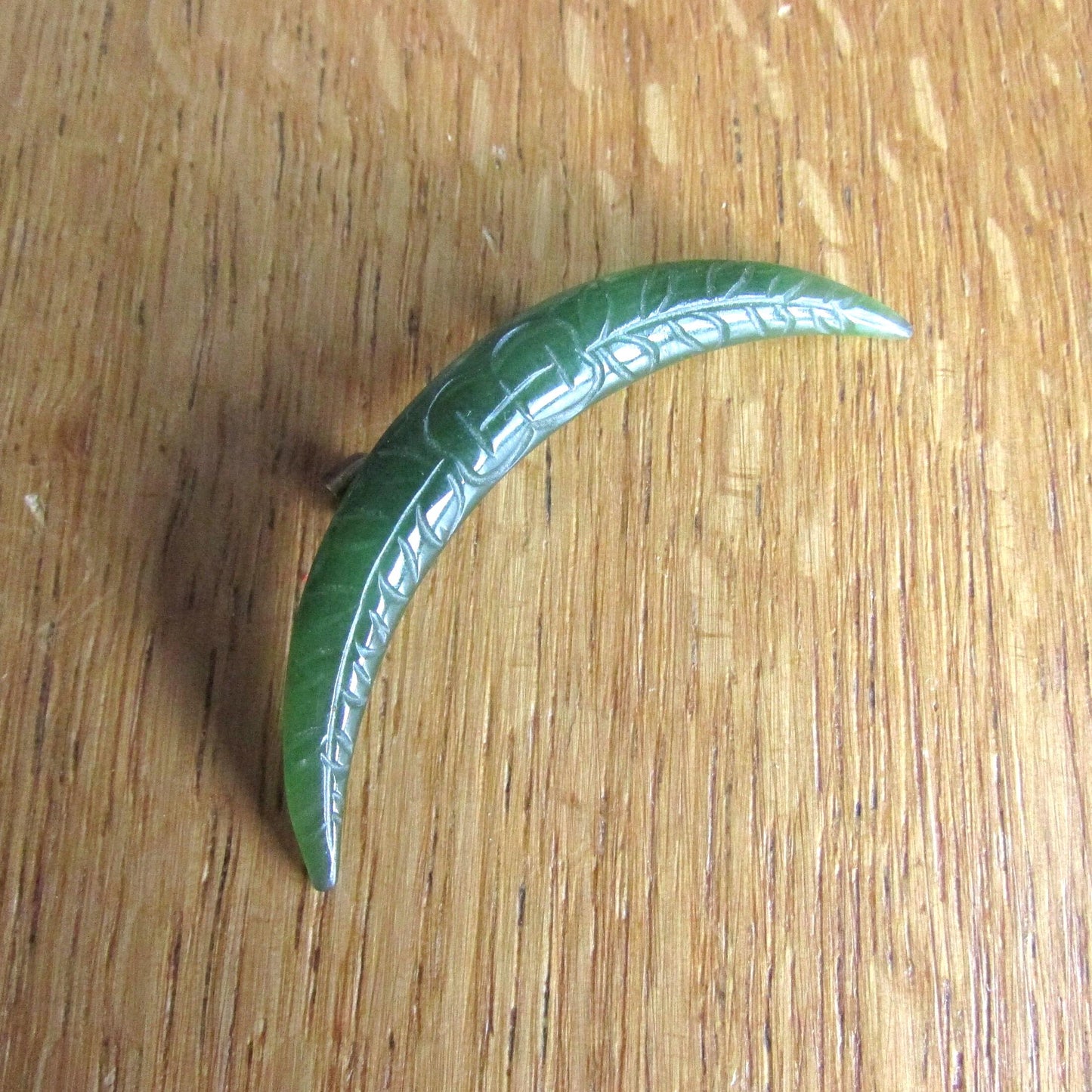 Home-made brooch using vintage carved jade crescent