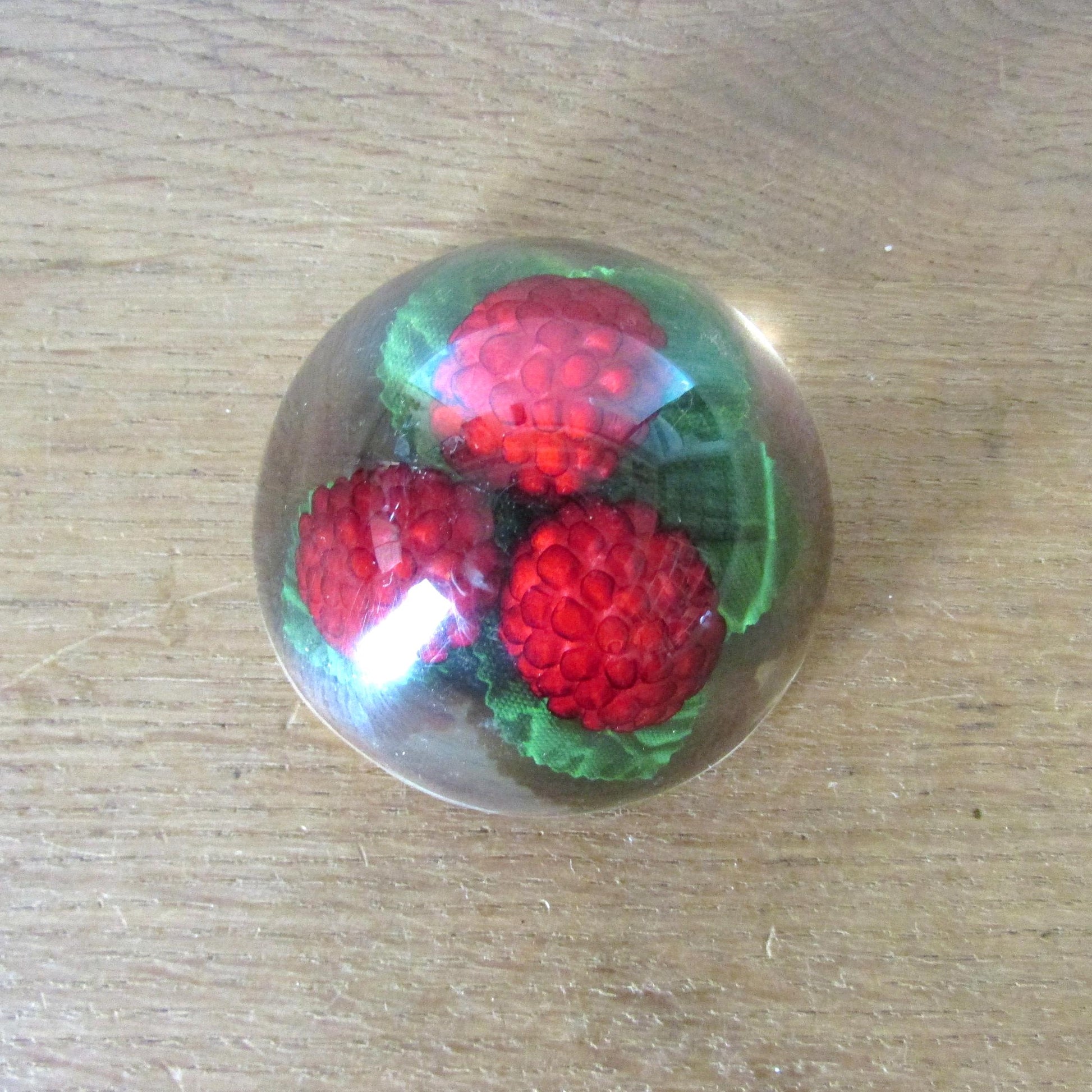 1960s kitsch acrylic domed raspberries paperweight