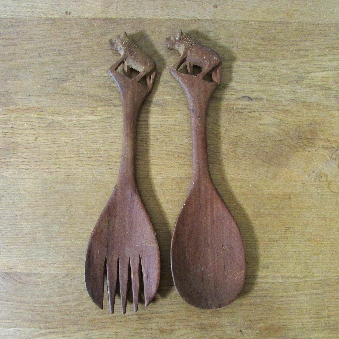 Pair of vintage hand carved wood lion salad servers