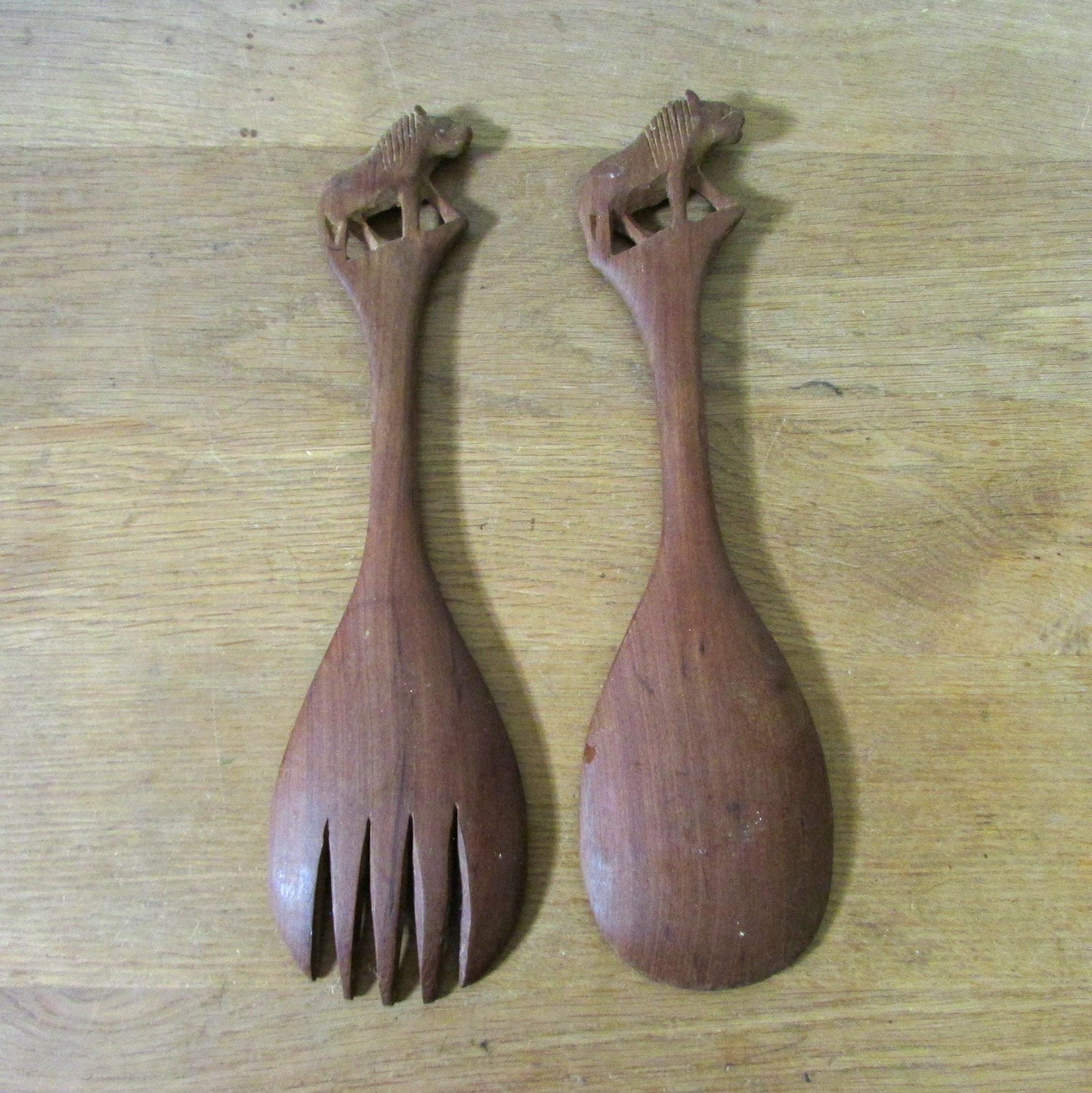 Pair of vintage hand carved wood lion salad servers