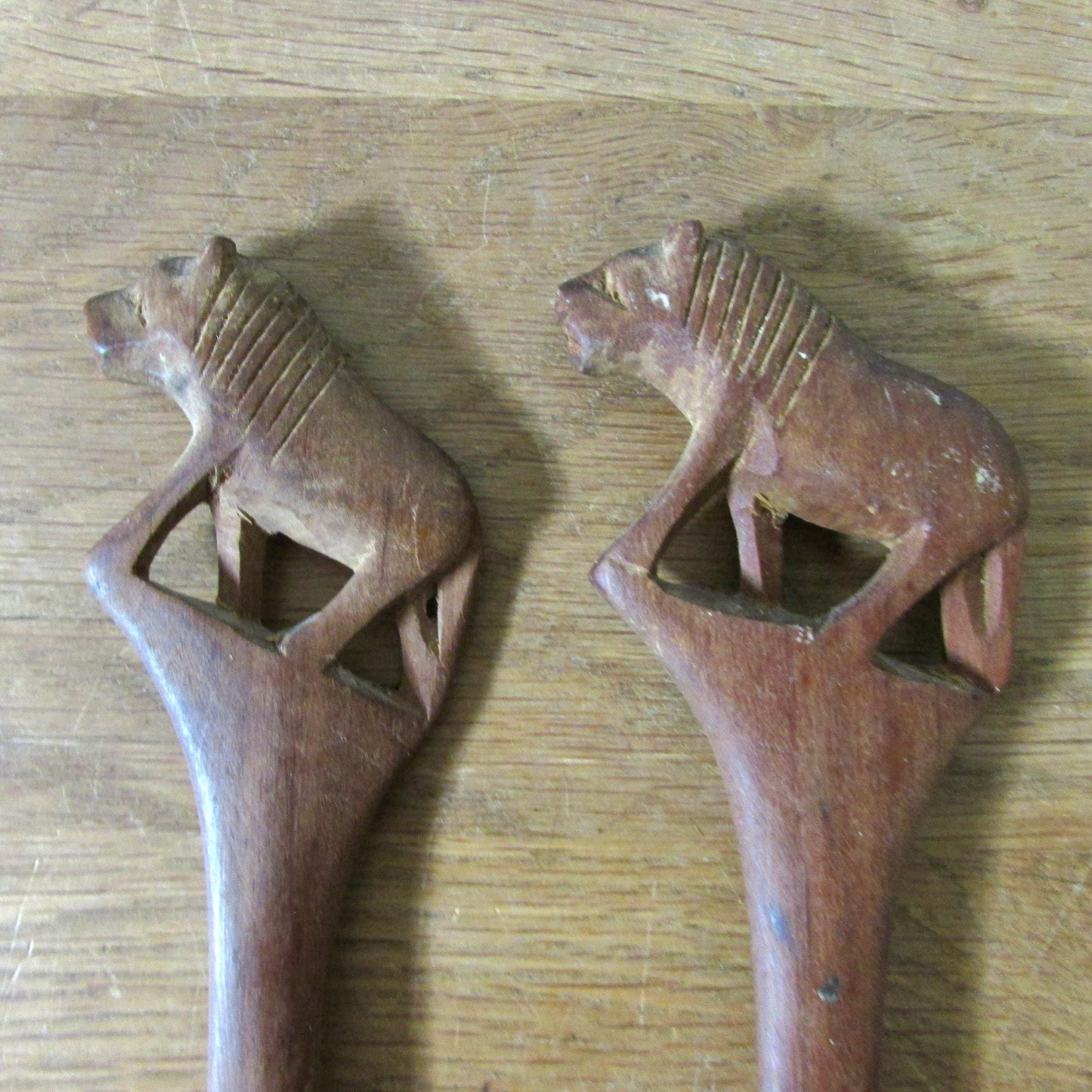 Pair of vintage hand carved wood lion salad servers