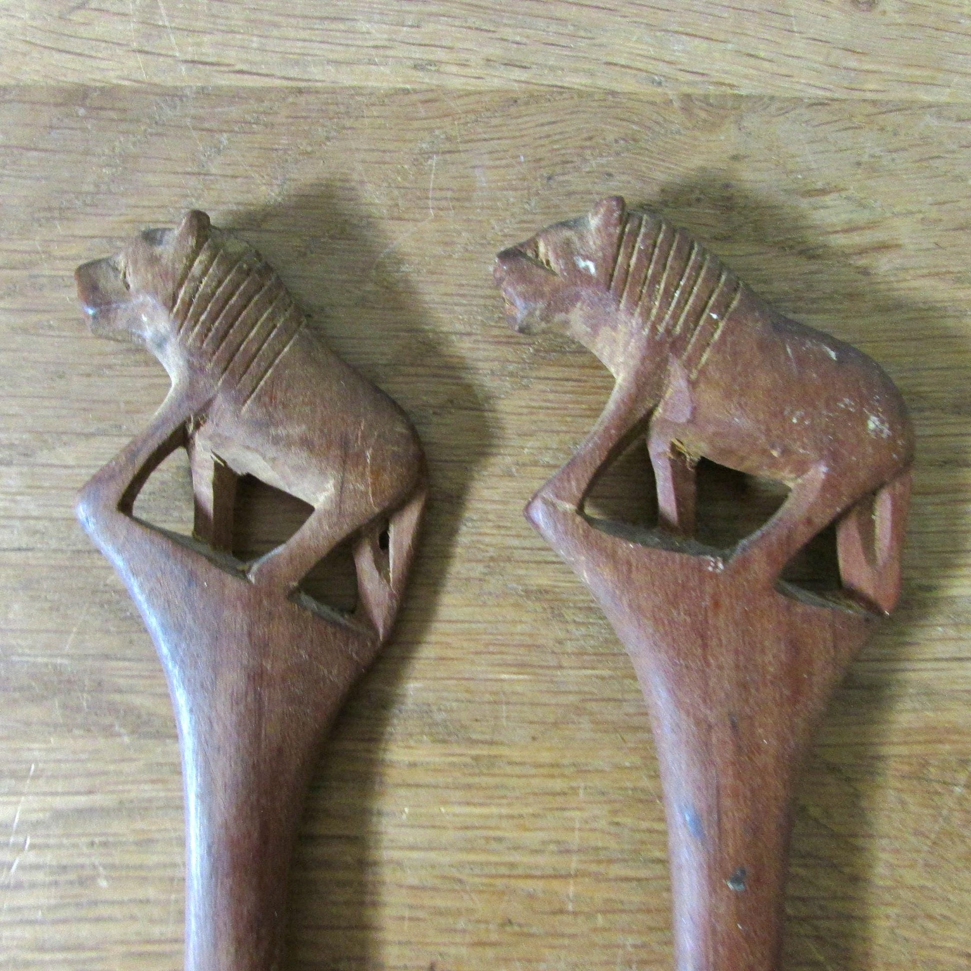 Pair of vintage hand carved wood lion salad servers