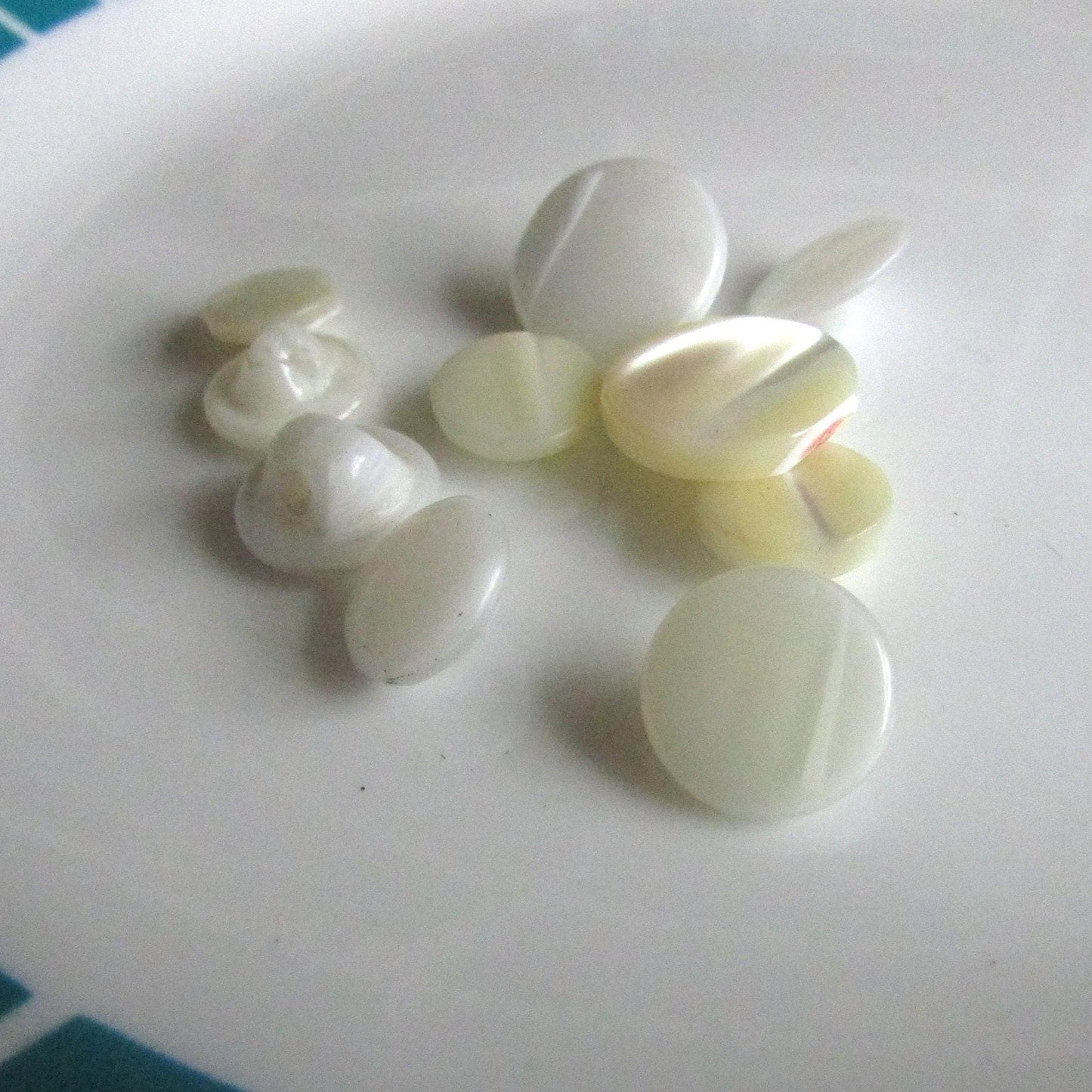 12 small vintage white, & cream glass round buttons
