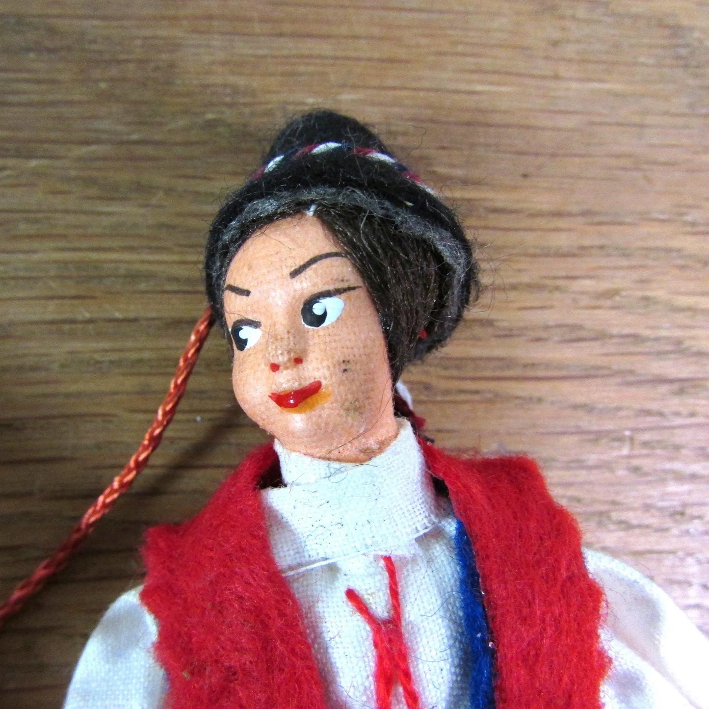 Pair of vintage miniature Yugoslavian souvenir dolls, linked together, in traditional costume