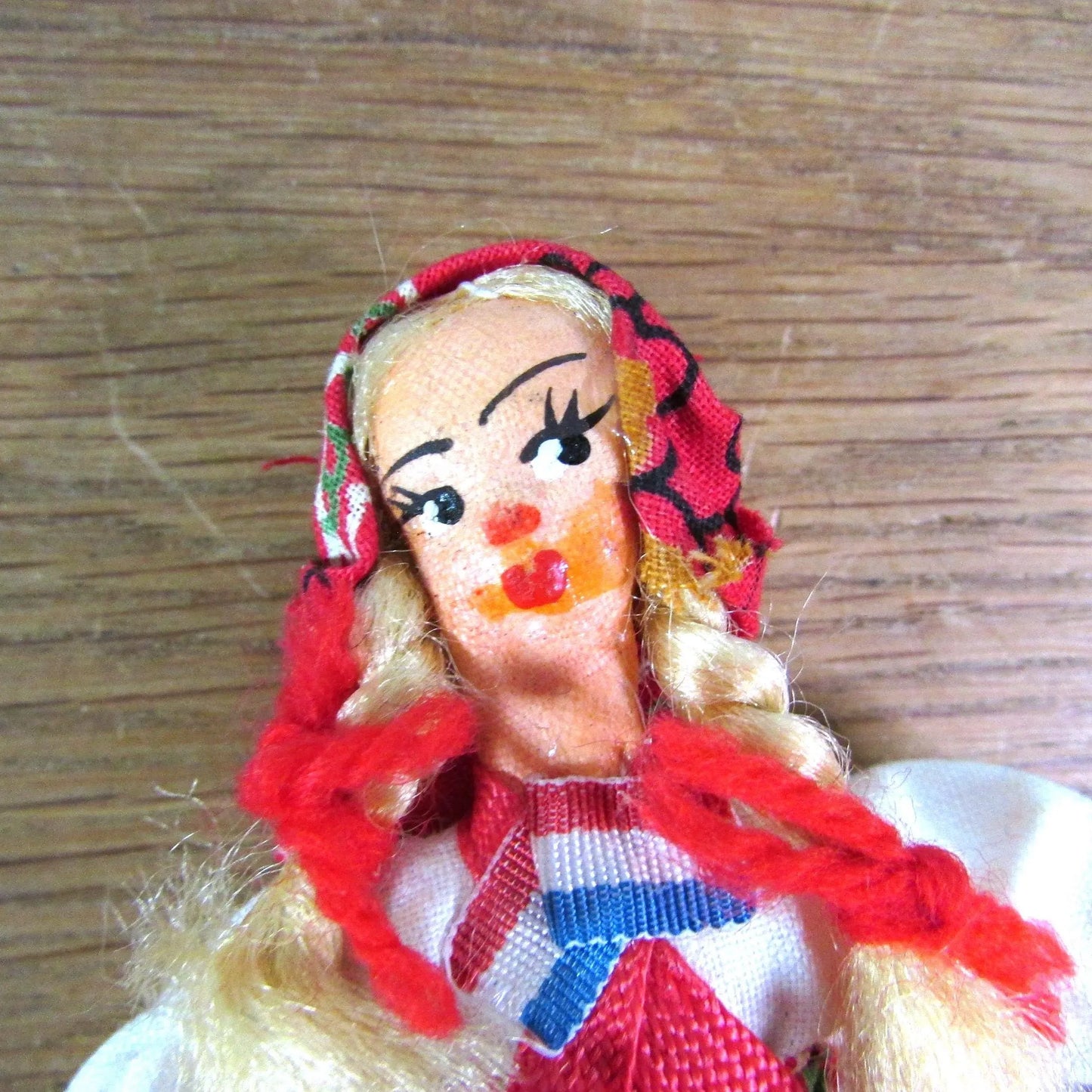 Pair of vintage miniature Yugoslavian souvenir dolls, linked together, in traditional costume