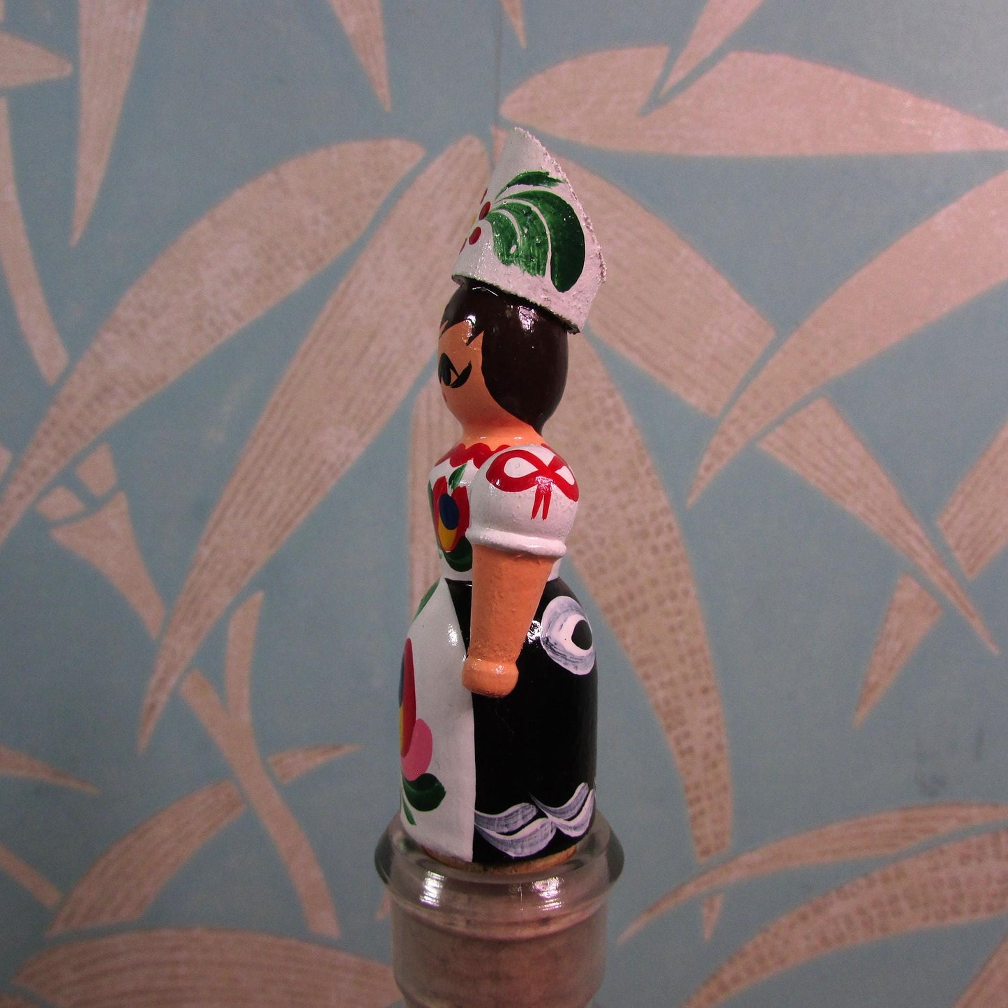 Kitsch vintage hand-painted girl in traditional folk costume cork bottle stopper