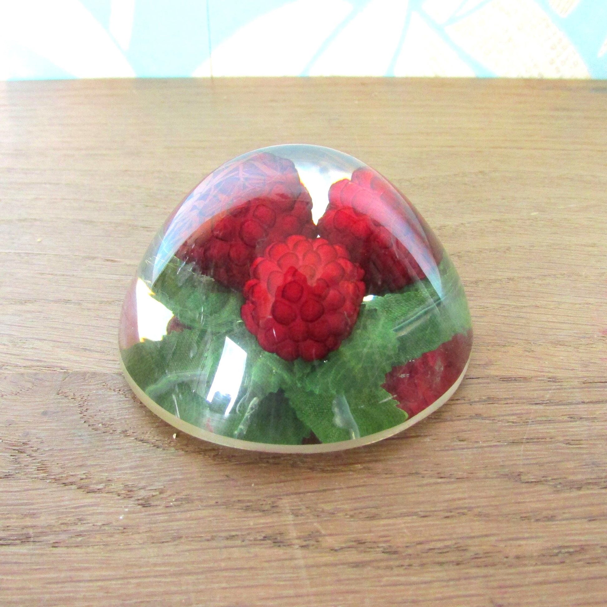 1960s kitsch acrylic domed raspberries paperweight