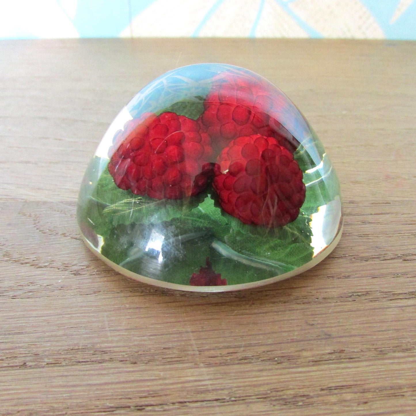 1960s kitsch acrylic domed raspberries paperweight