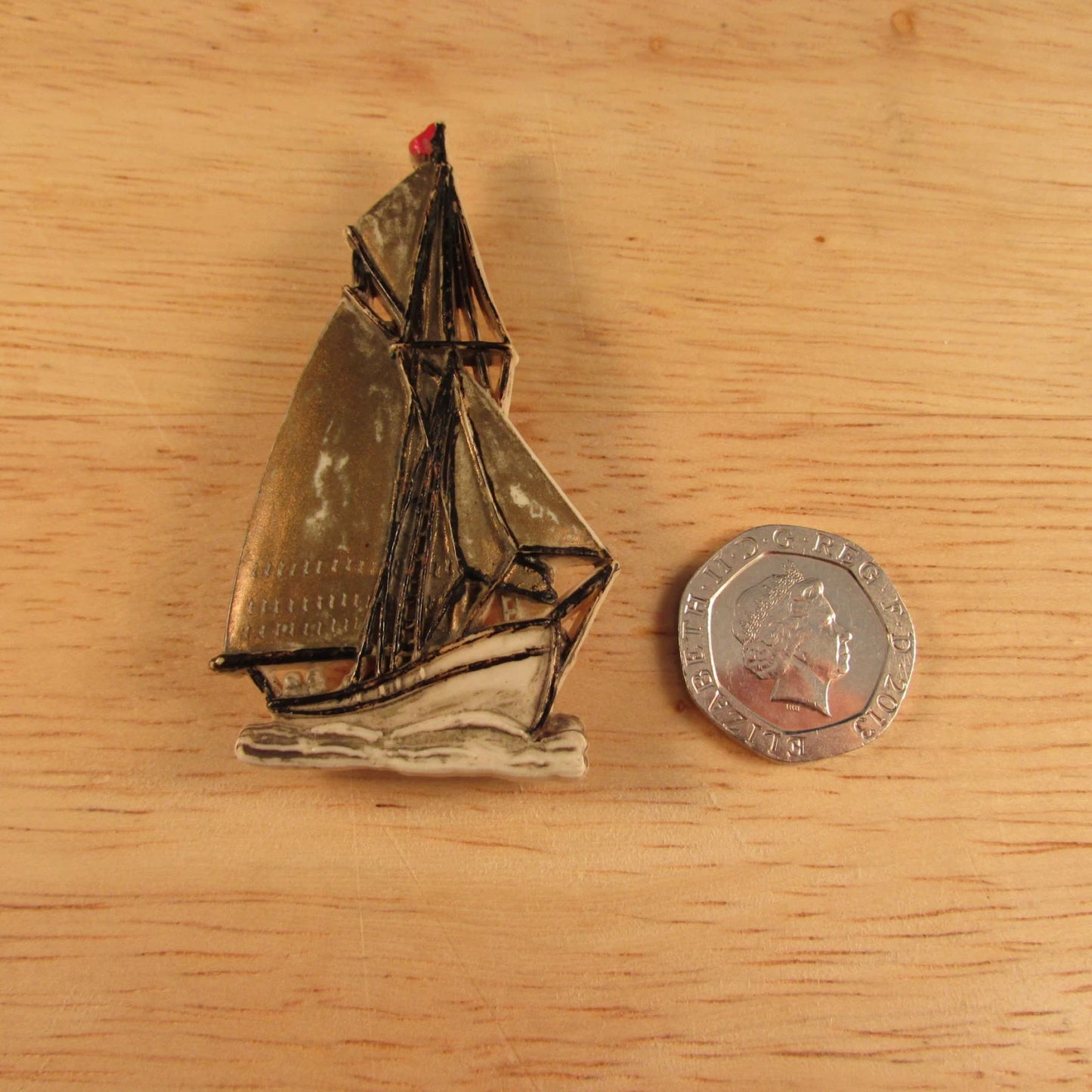 Vintage plastic tall ship brooch, stamped Made in England