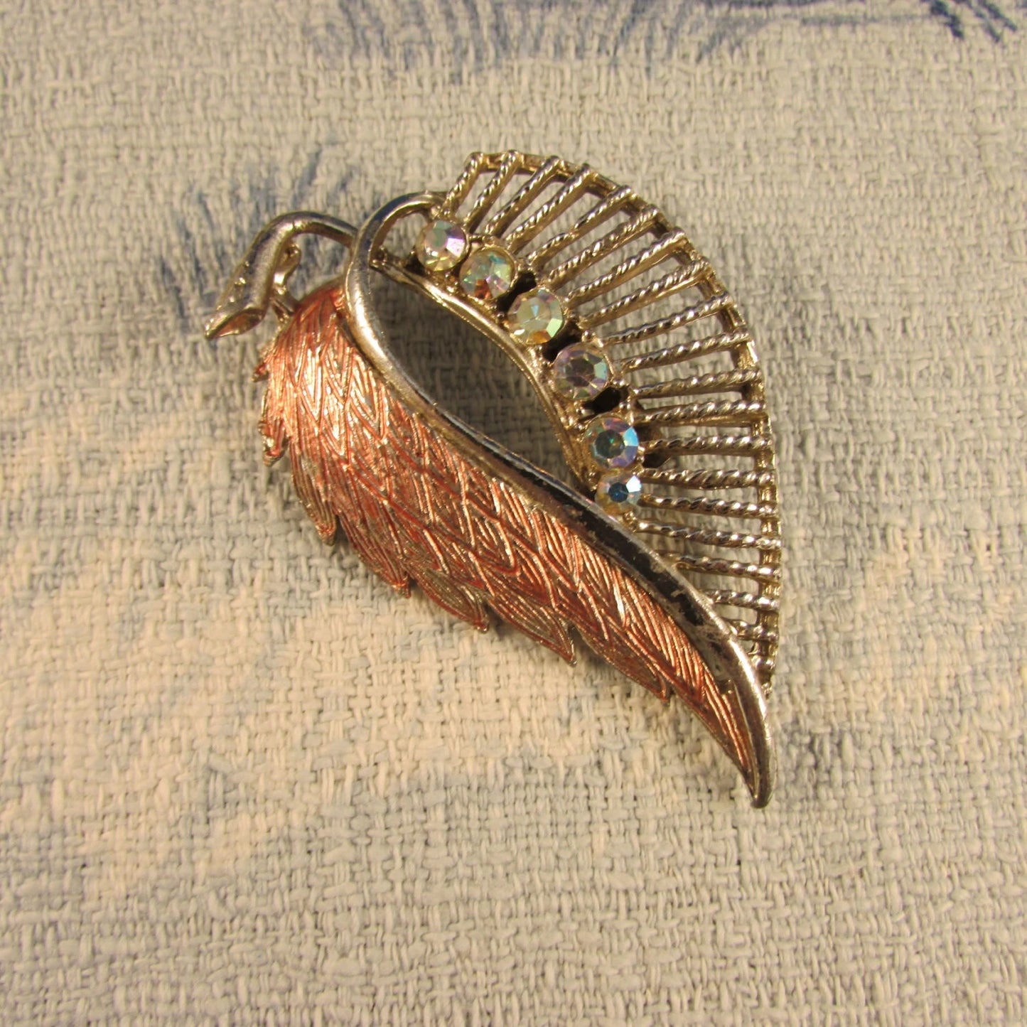 1950s silver-tone leaf brooch with Aurora Borealis stones & copper tone detail