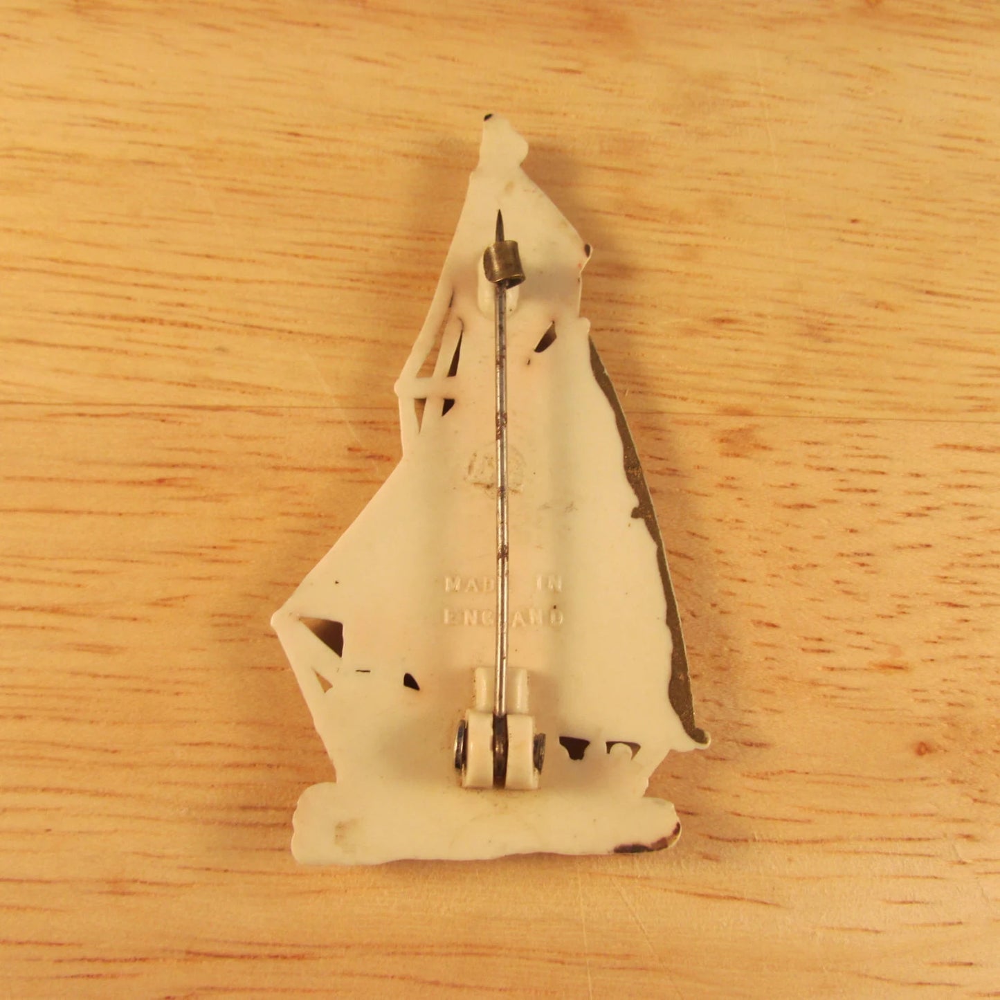 Vintage plastic tall ship brooch, stamped Made in England