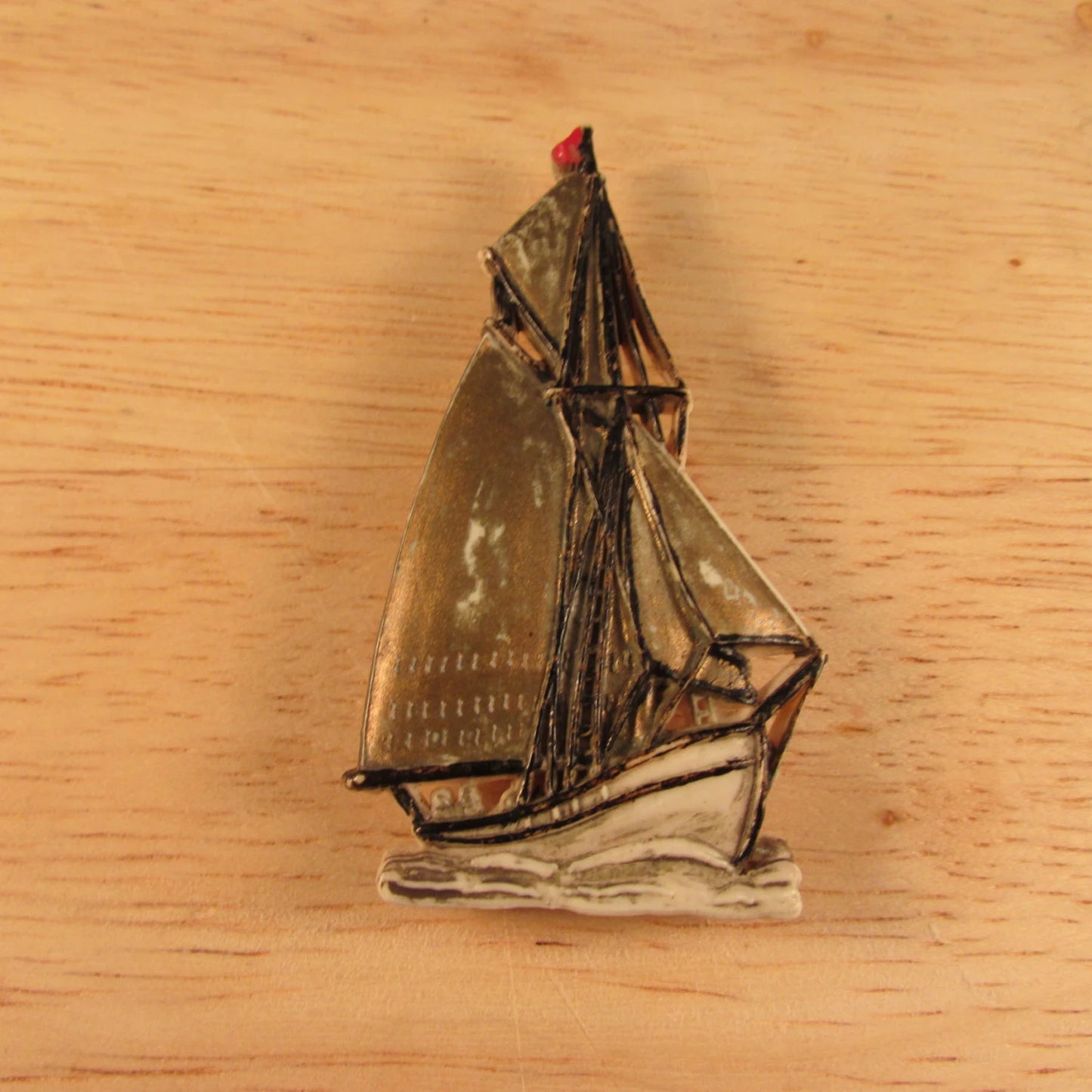 Vintage plastic tall ship brooch, stamped Made in England