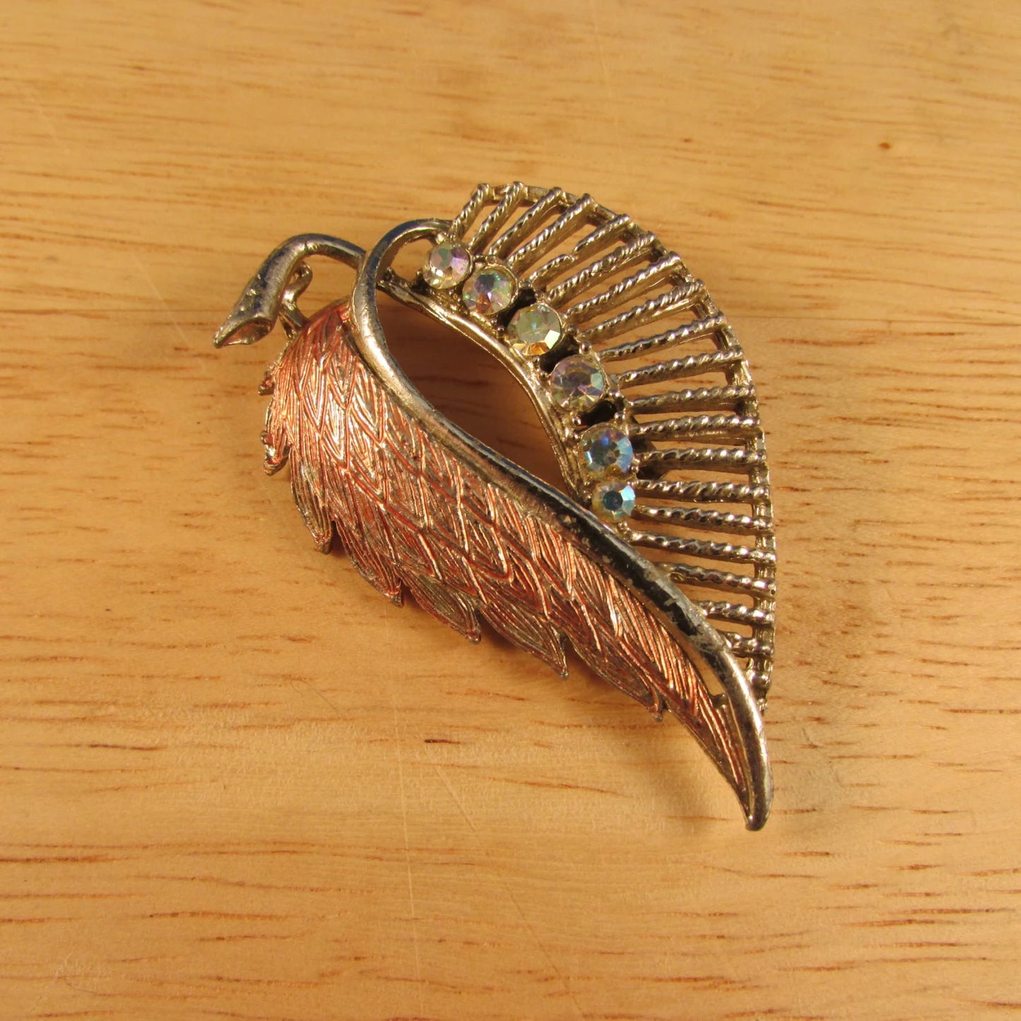 1950s silver-tone leaf brooch with Aurora Borealis stones & copper tone detail
