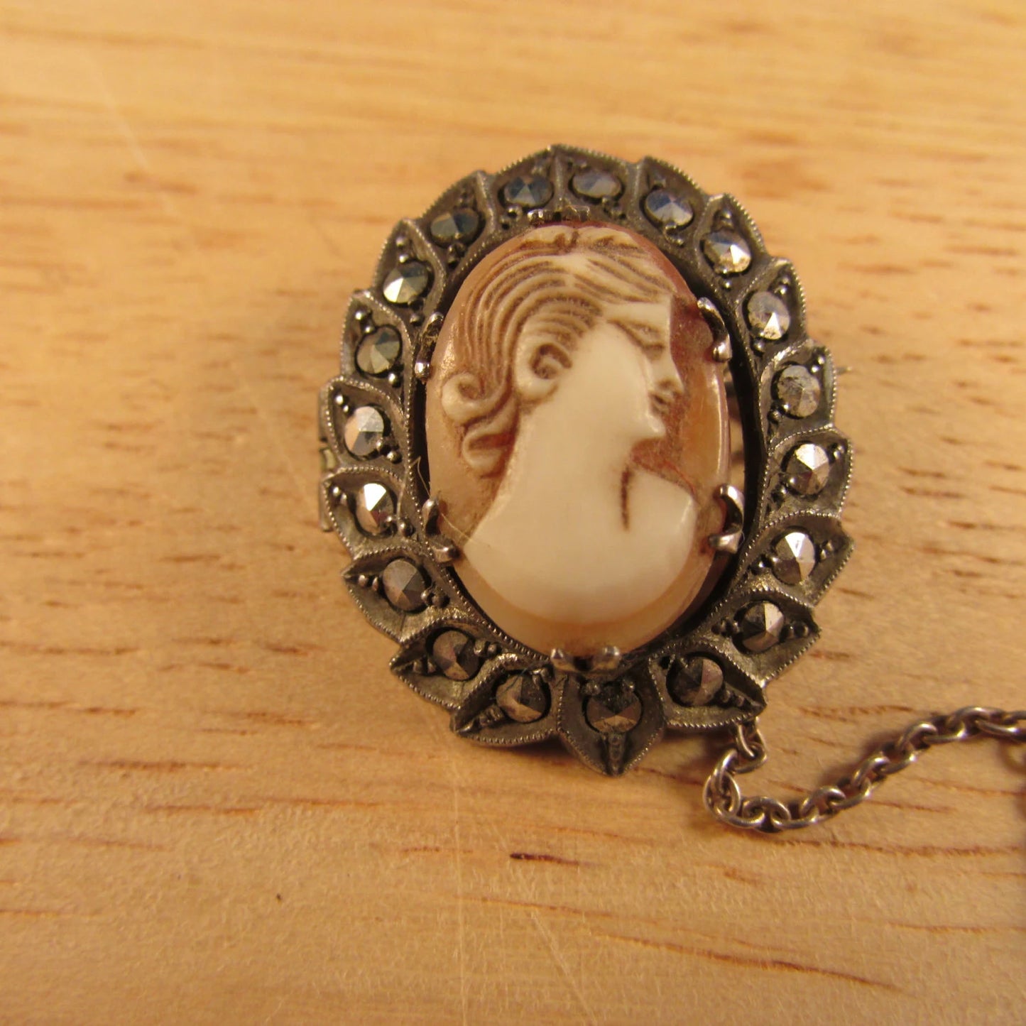 Victorian silver marcasite cameo wreath brooch with safety chain