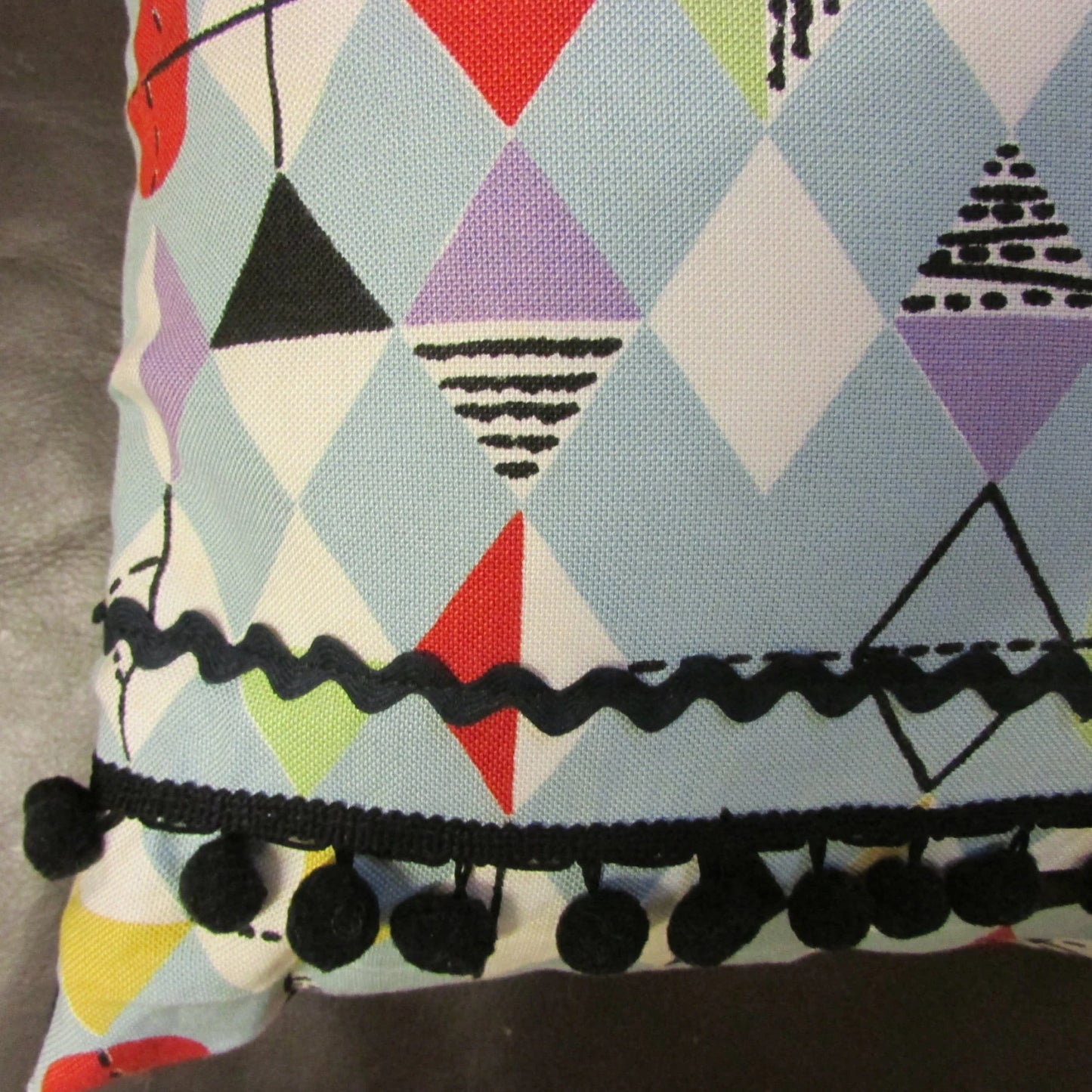 Home-made mid-century Marian Mahler atomic fabric cushion, black ric-rac, & pompom trim, and contrast black reverse