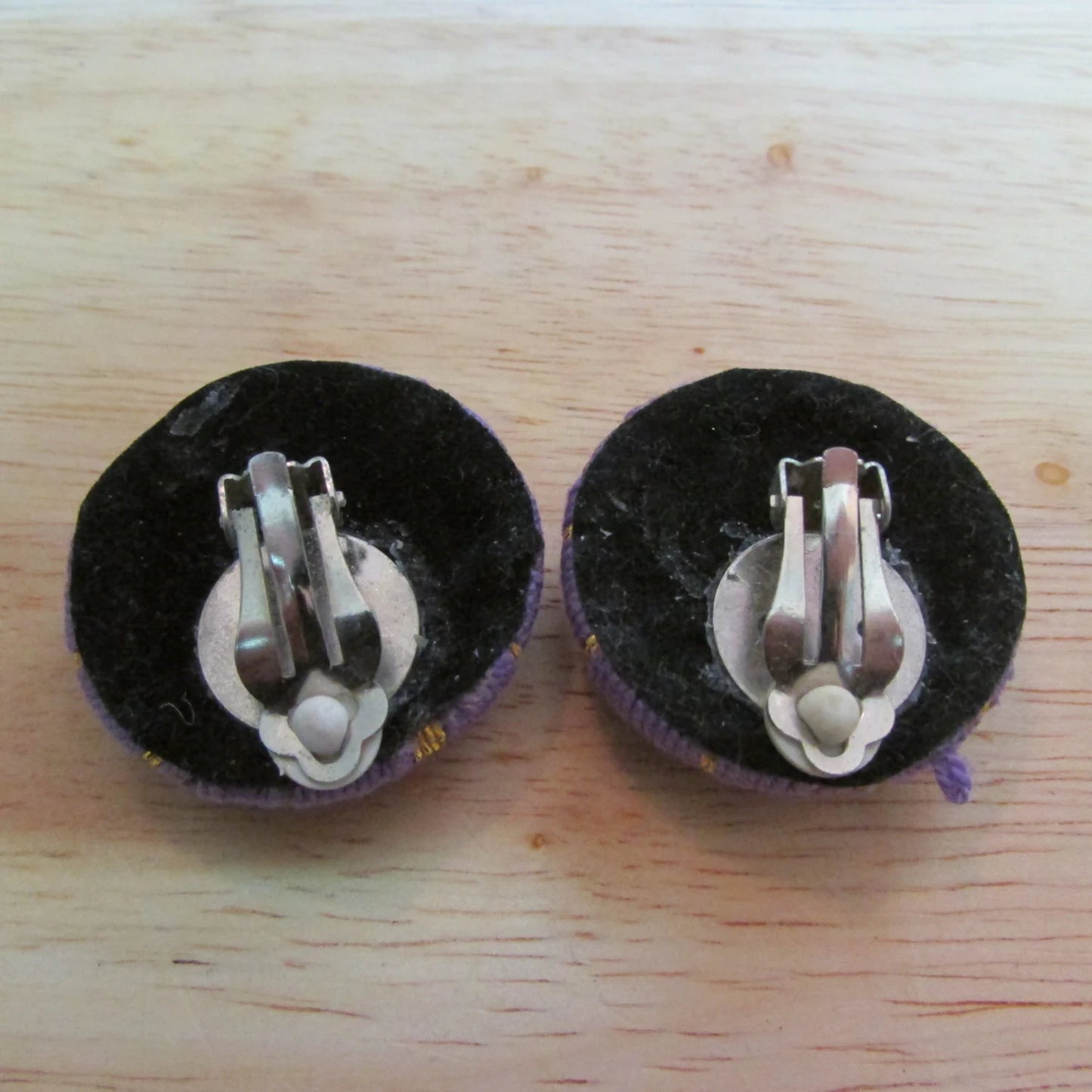 circa. 1980s large purple & gold thread covered button clip-on earrings