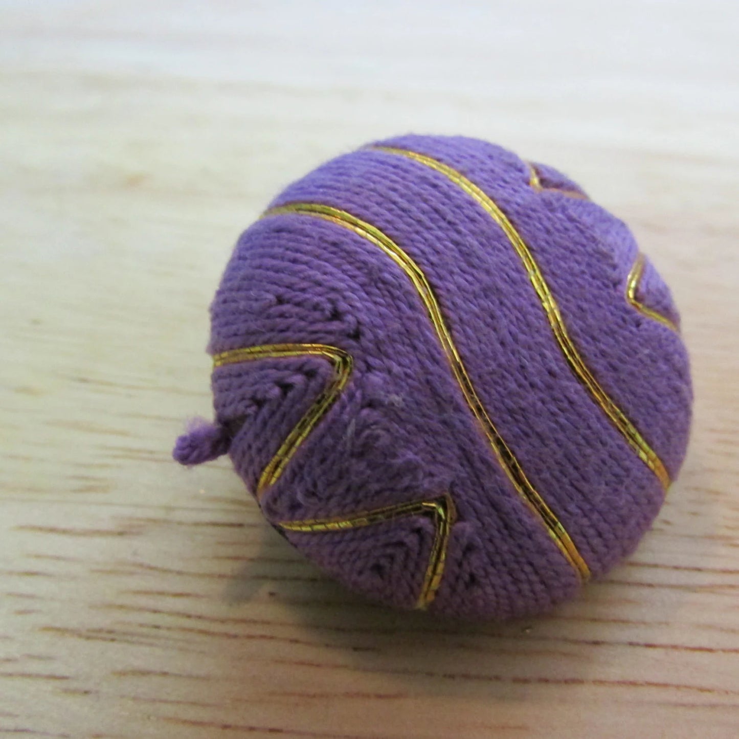 circa. 1980s large purple & gold thread covered button clip-on earrings