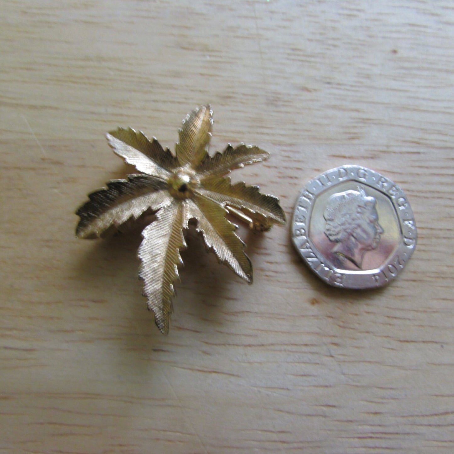 Vintage gold-tone palm frond leaf brooch, stamped CANADA