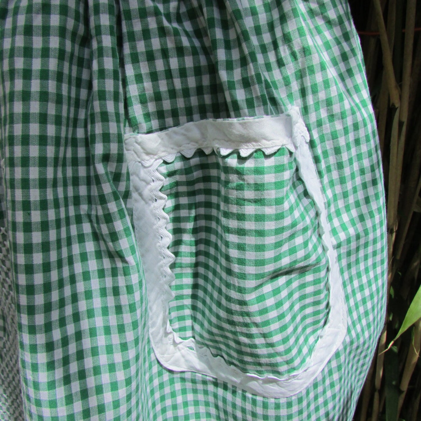 1950s/60s green gingham half apron with contrast white trim & cross stitch crinoline lady detail