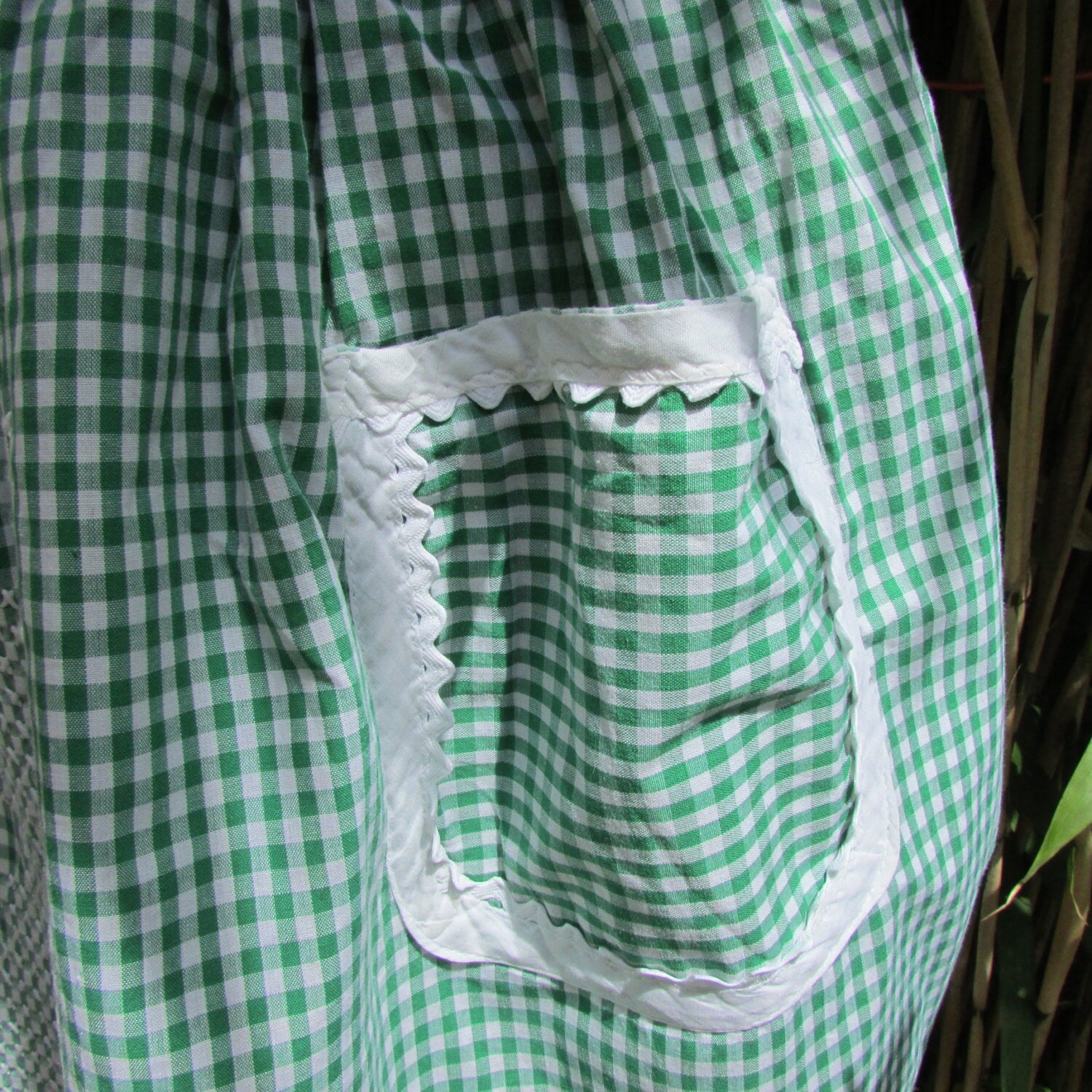 1950s/60s green gingham half apron with contrast white trim & cross stitch crinoline lady detail