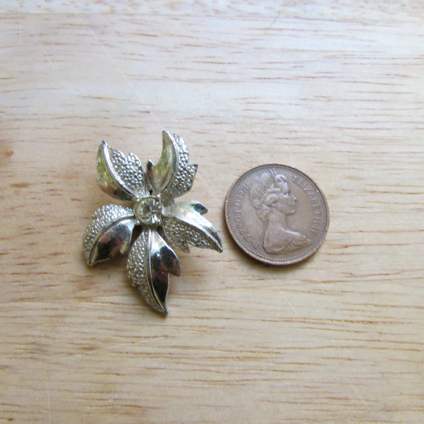 Late 1950s silver-tone & citrine rhinestone textured flower clip-on earrings