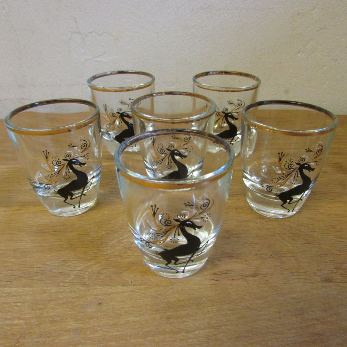 Set of 6 mid-century black & gilt reindeer shot glasses