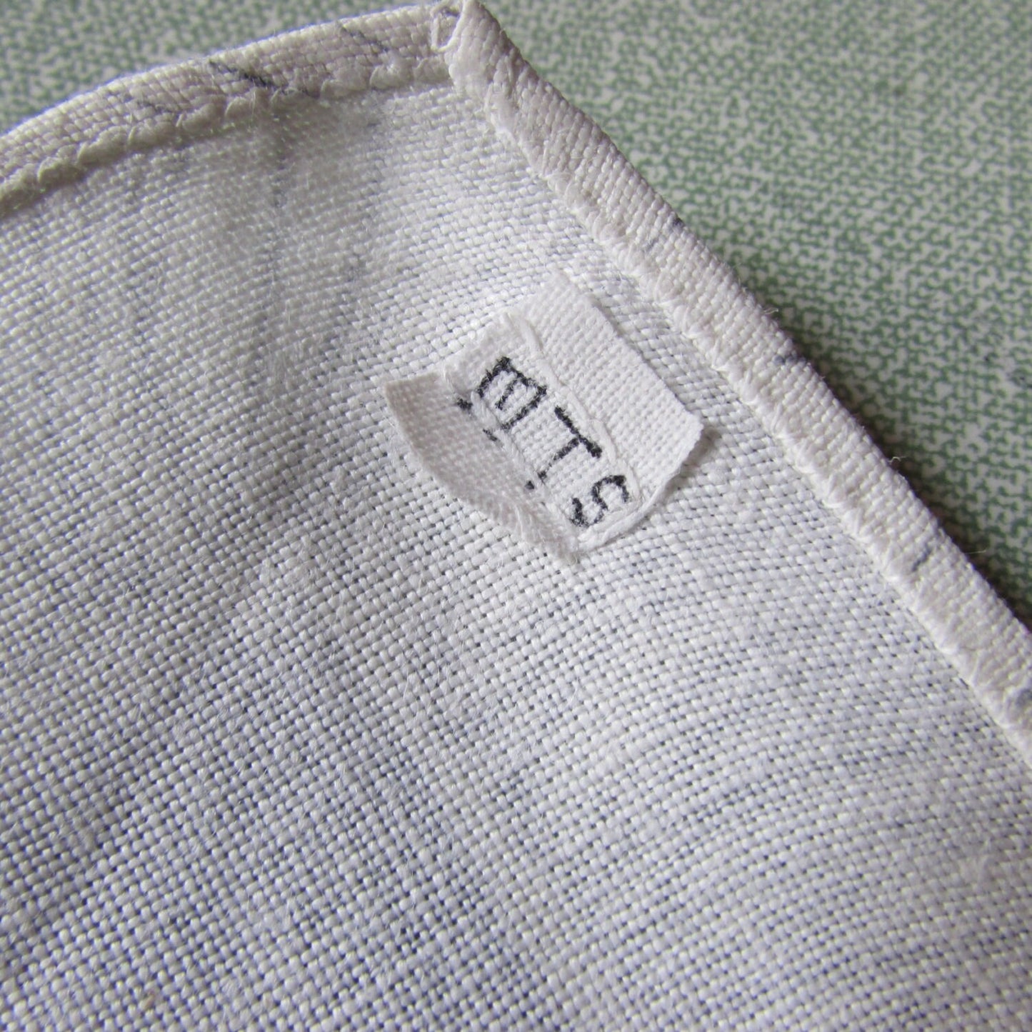 Pair of 1950s linen-like placemats, patterned border