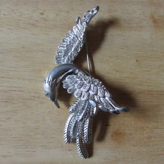 1950s large silver-tone bird in flight brooch with textured feather detail & diamanté eye