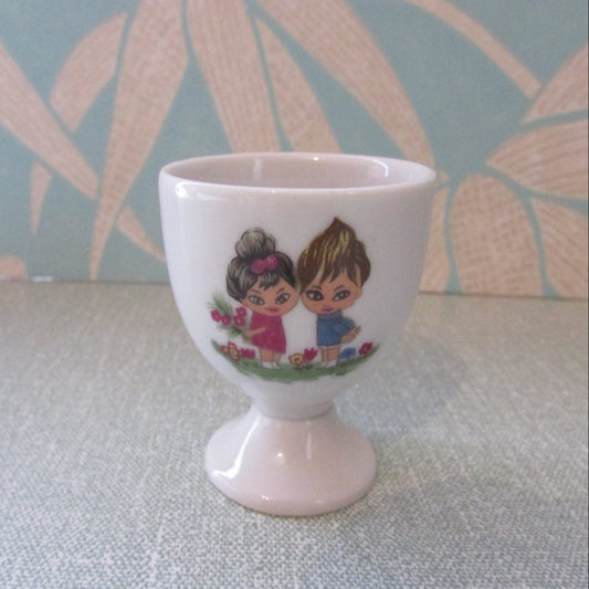 1970s retro egg cup, cute illustration of boy & girl amongst flowers