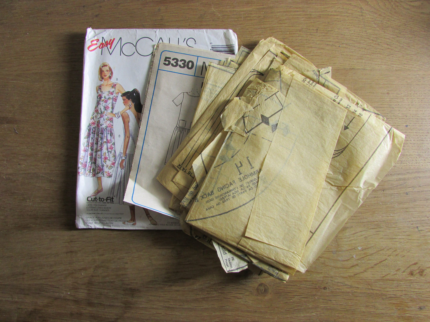 Part cut 1991 McCall's 5330 sewing pattern for misses' dress & sundress, sizes 12 to 16 (part cut to size 16, complete)