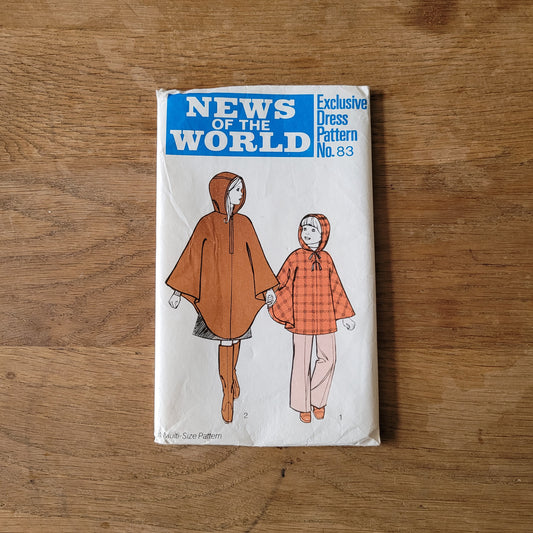 Uncut 1970s News of The World No.83 sewing pattern for hooded poncho, sizes 3/4 years to 9/10 years (complete)