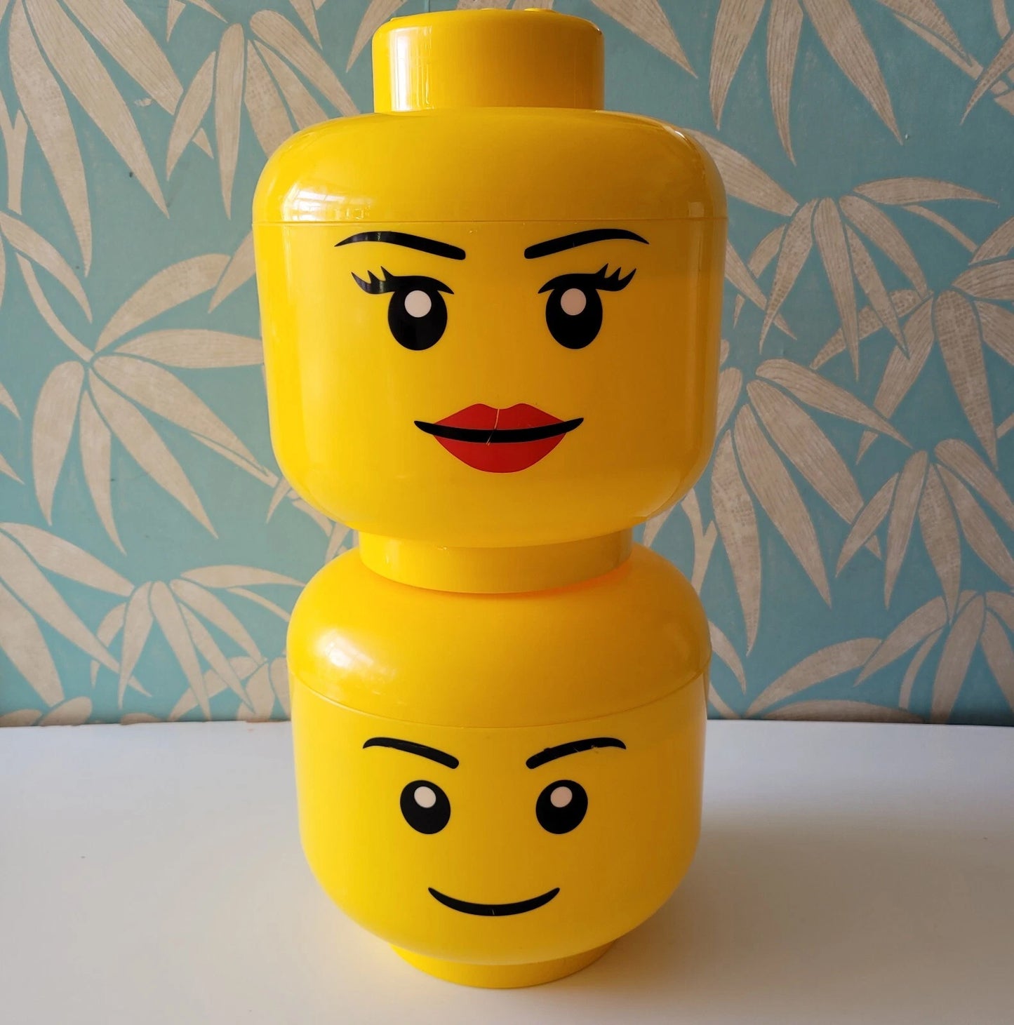 Pair of large 2012 LEGO male & female head plastic storage containers