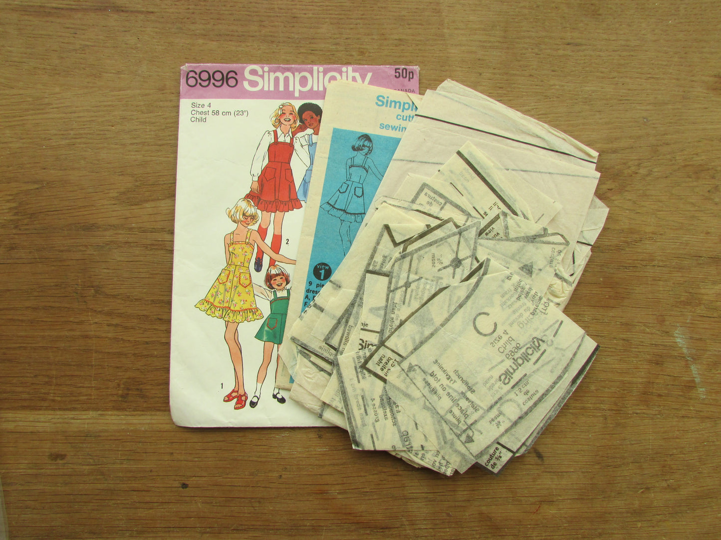 Part cut 1975 Simplicity 6996 sewing pattern for child's & girls' dress or jumper, size 4 (complete)