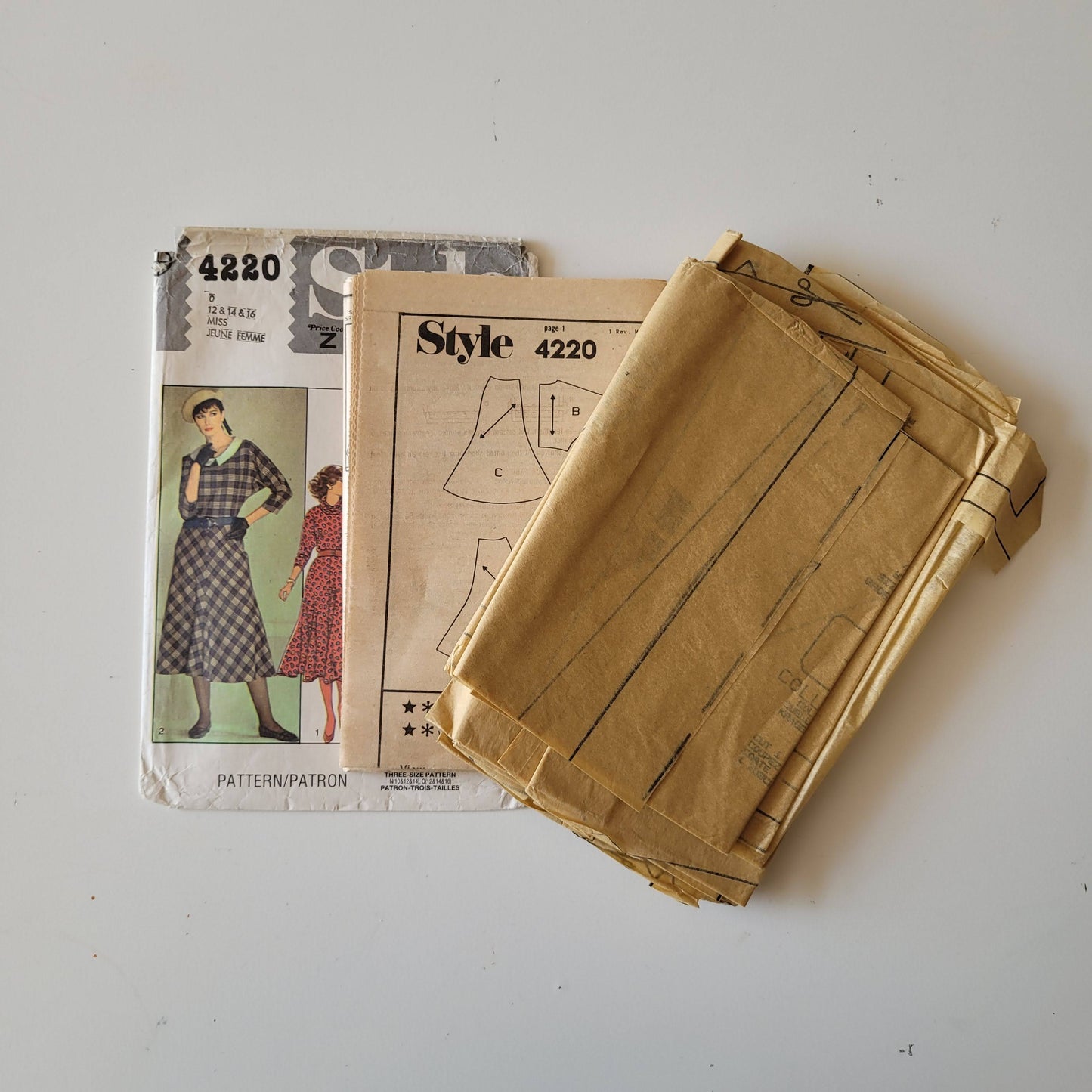 Part cut 1984 Style 4220 sewing pattern for misses' dress with collar & skirt variations (complete, part cut to size 12)