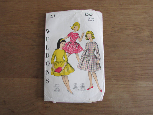 Uncut 1950s/60s Weldons 8267 sewing pattern for girl's dress with dropped waistline, & gathered skirt, size 7-8 years (complete)