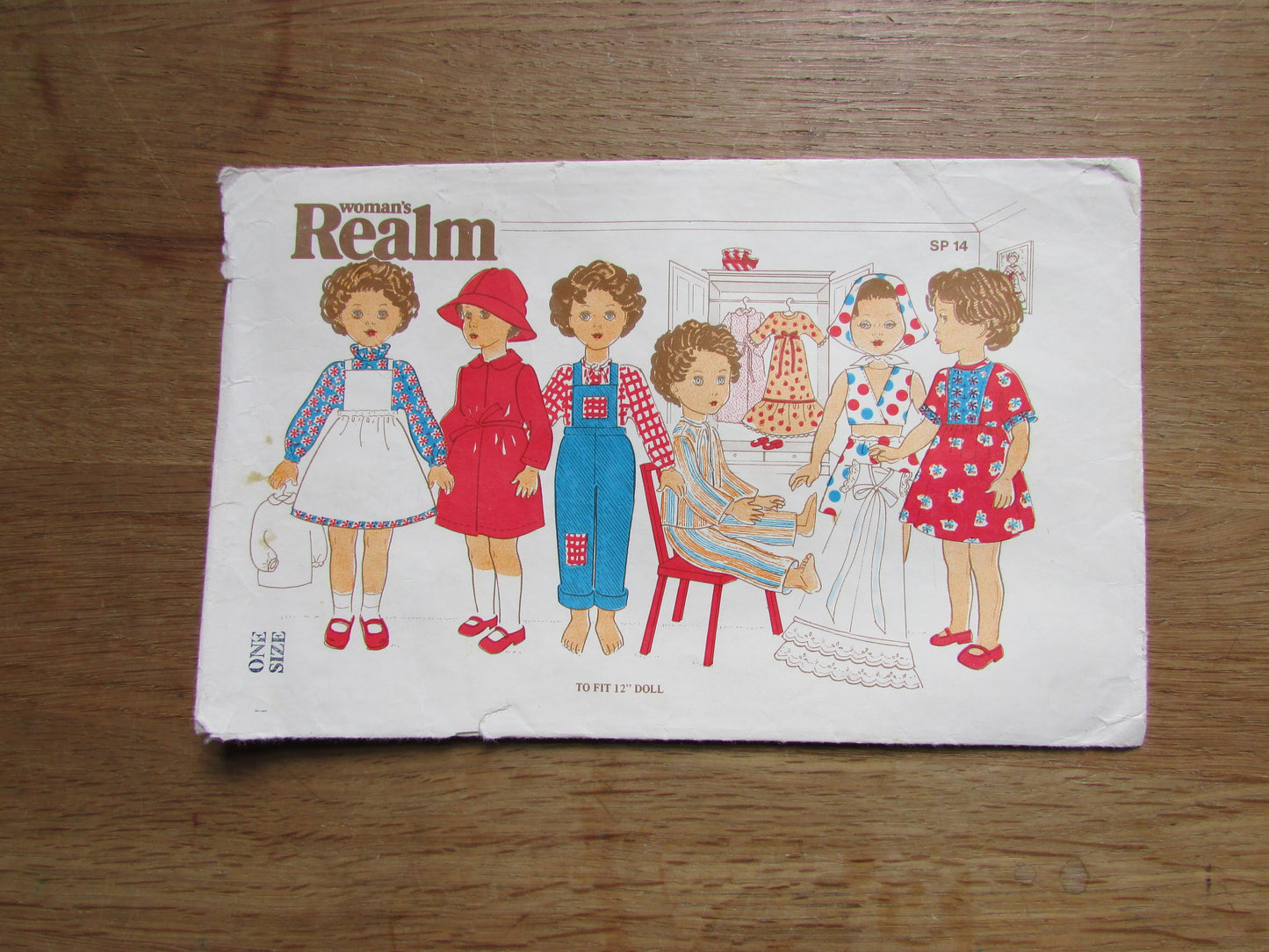 Part cut vintage Woman's Realm SP14 sewing pattern for doll clothes, to fit 12" doll (complete)